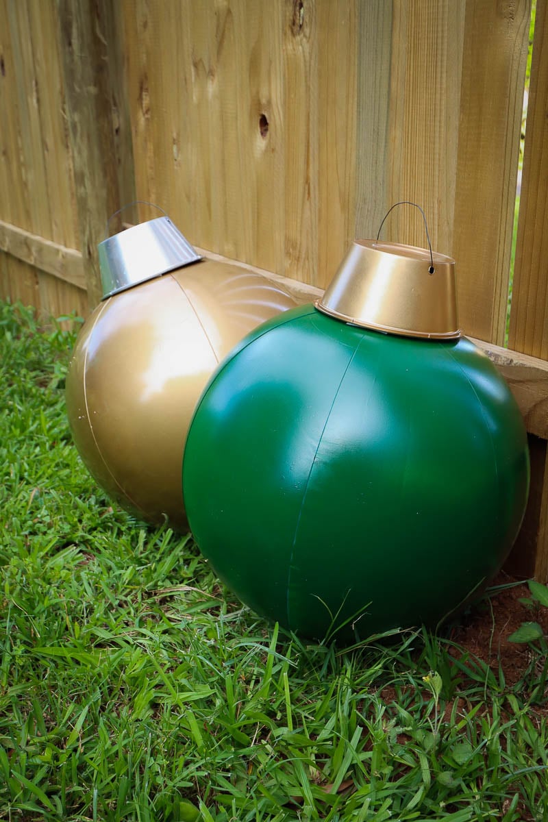A green and a gold outdoor bauble made from beach balls