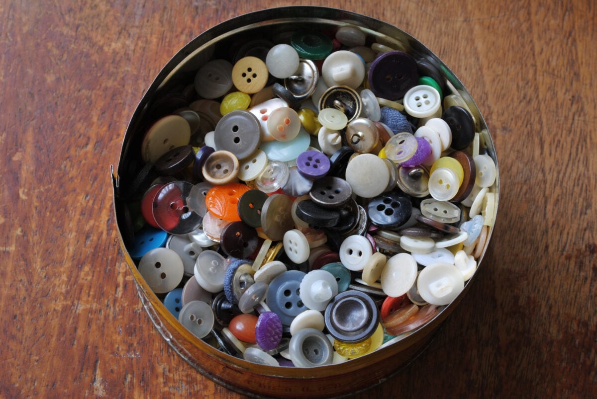 A tin of buttons.