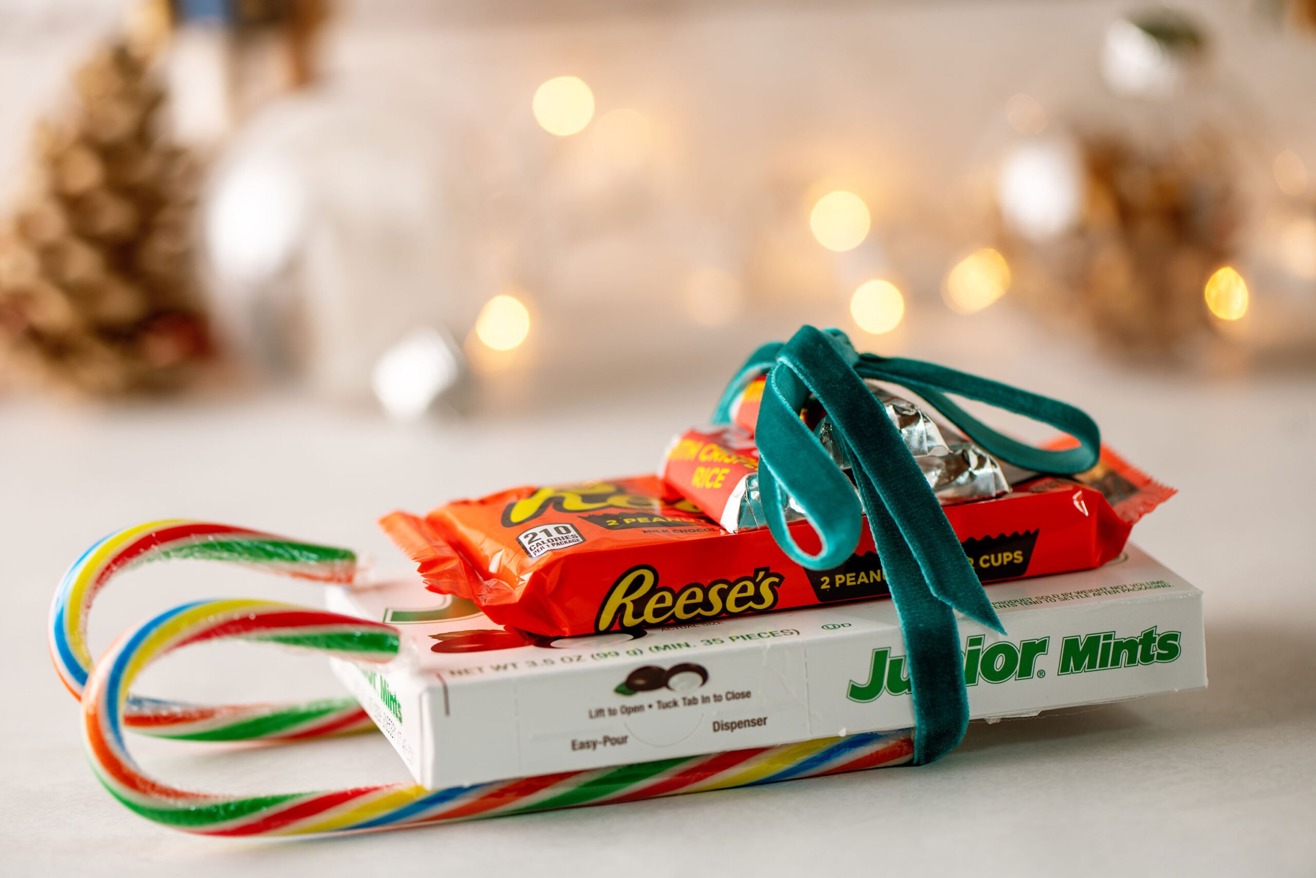 Candy cane sleigh carrying boxed and wrapped candy