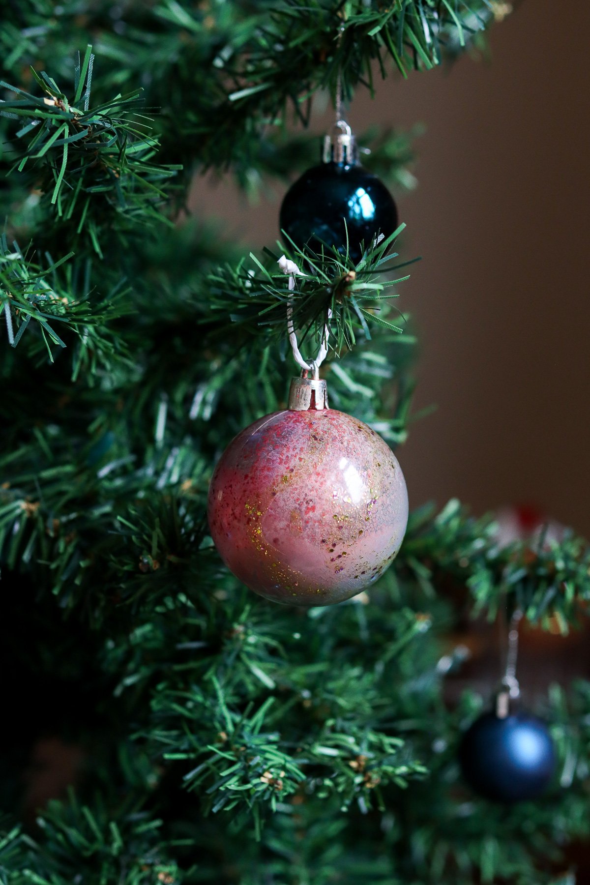 Galaxy Christmas bauble on Christmas tree