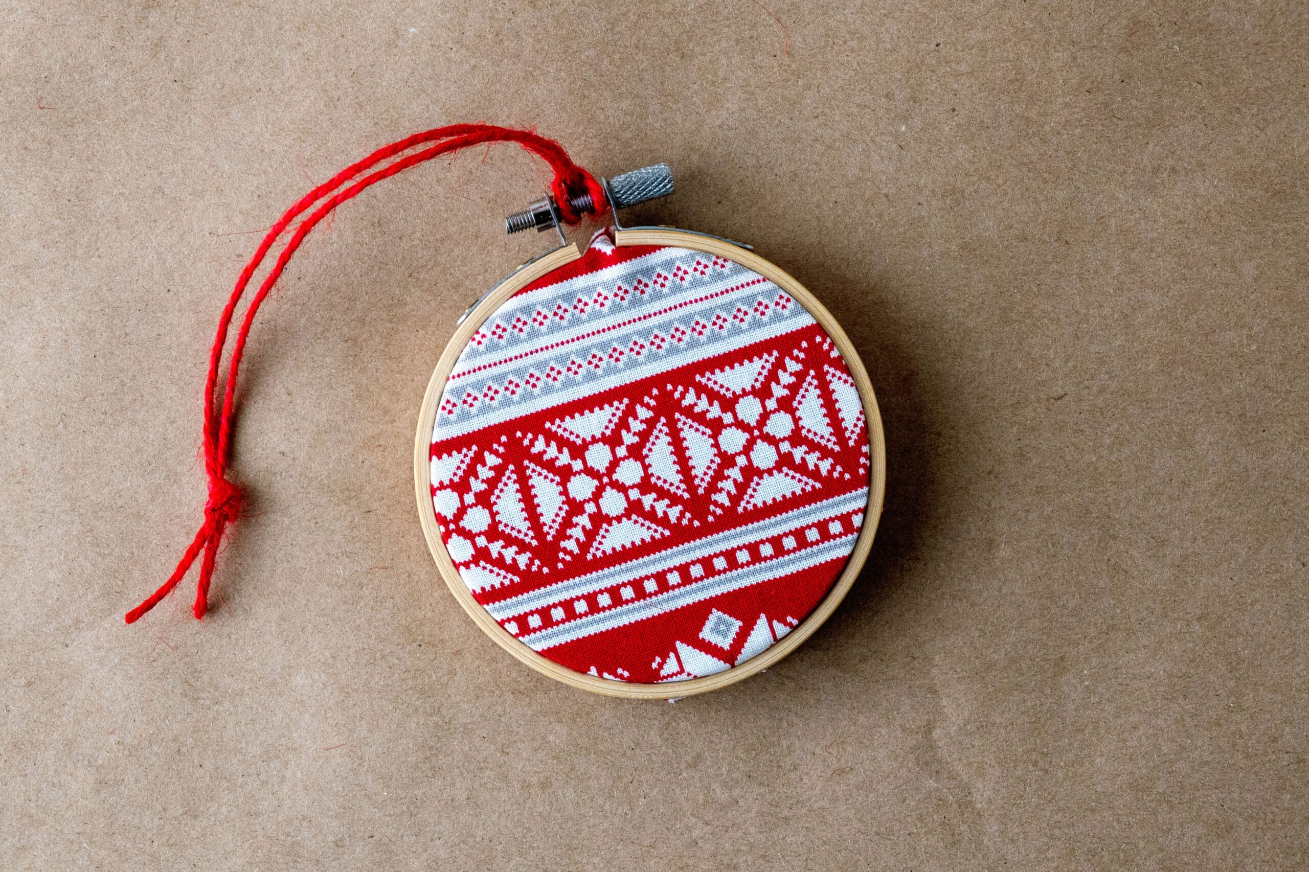 Embroidered red and white hoop ornament