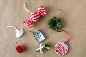 Assorted handmade ornaments on kraft paper