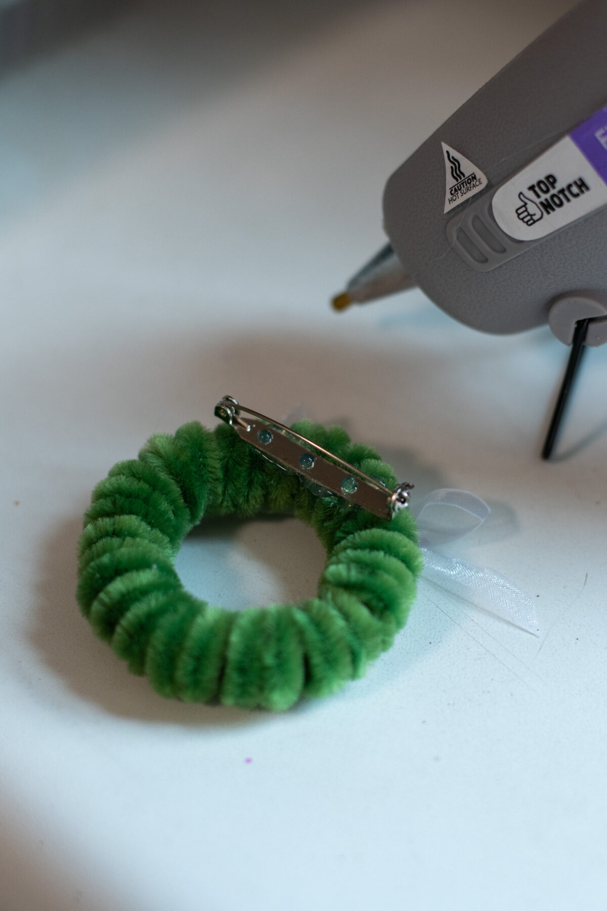 Pipe cleaner Christmas wreath pin